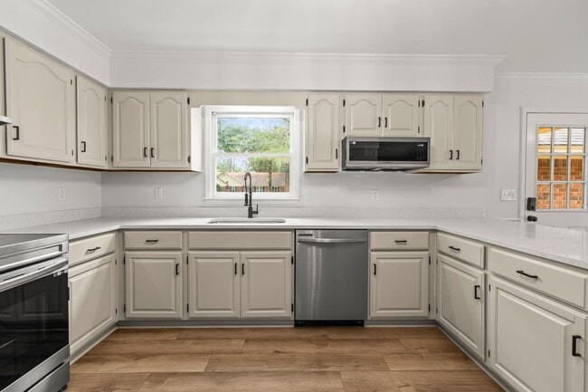 Building Photo - Renovated Home on Large Corner Lot in Coveted Strathy Hall