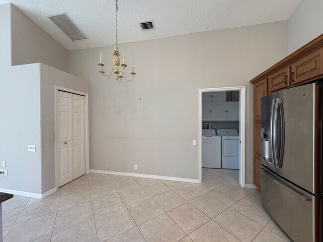 Building Photo - 4 Bedroom 2 Bathroom + Den - Attached Garage and  Heated  Pool!