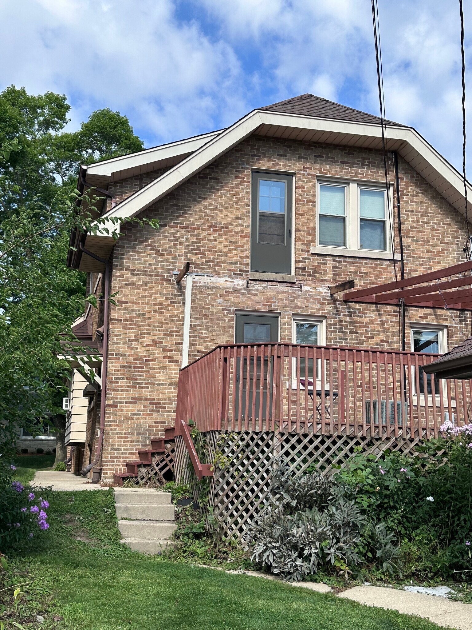 Rear of house with deck. - 3466 S Delaware Ave