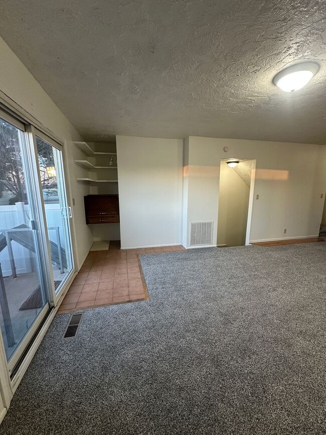 Building Photo - Spacious, three level, 4 Bed 2.5 bath Townhome in Ammon right behind the Walmart on Hitt.