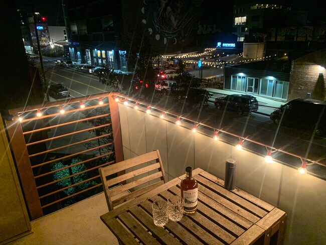 Perfect balcony space to enjoy a cocktail, meal, people watch, or just relax with a book. - 3101 Blake St
