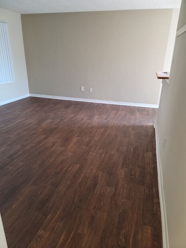 Building Photo - Welcome home to Seabreeze Garden Apartments