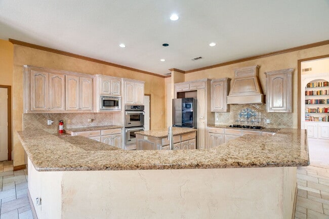 Building Photo - "Stately Gated 5-Bedroom Estate With Pool, Custom Details & Abundant Living Space!"