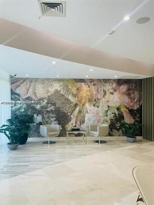 Building Photo - 10275 Collins Ave