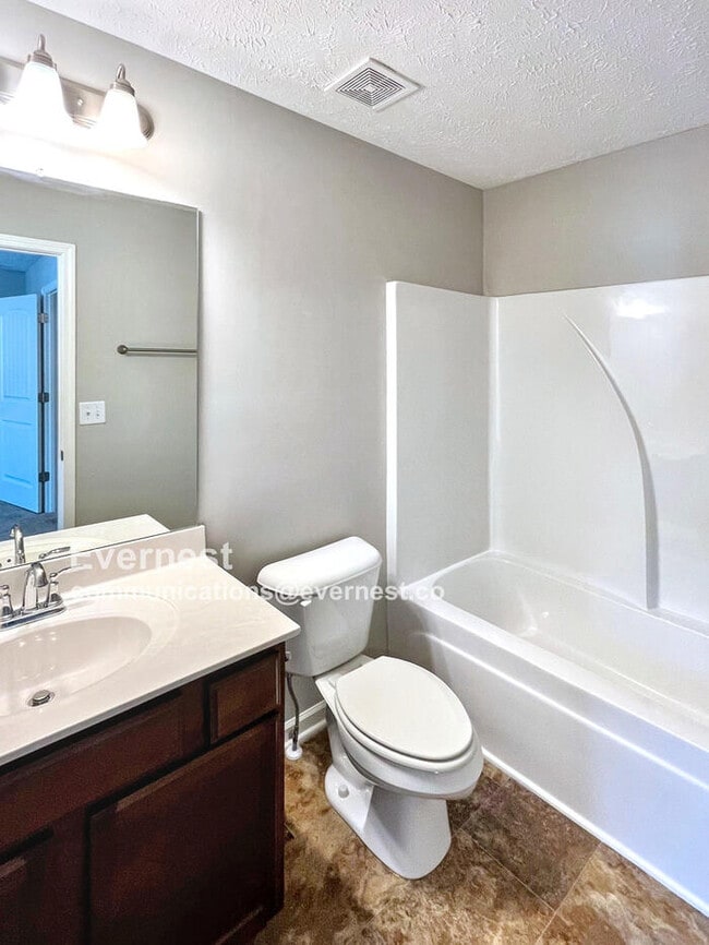Building Photo - Charming 2BR Townhouse with Modern Comfort...
