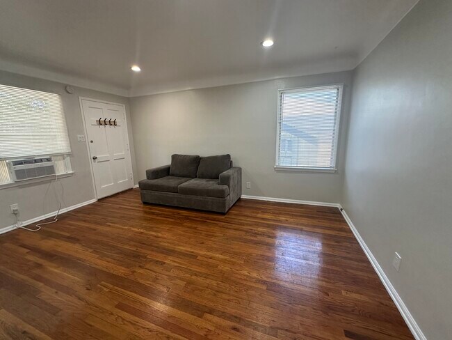 Spacious studio with wood floors in the main living area - 5646 Farmdale Ave