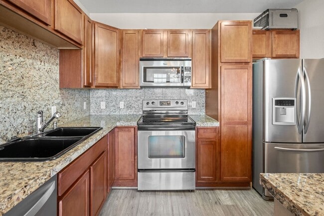 Building Photo - Charming 2 Bed, 2 Bath Top-Floor Condo with Great Sunrise Views