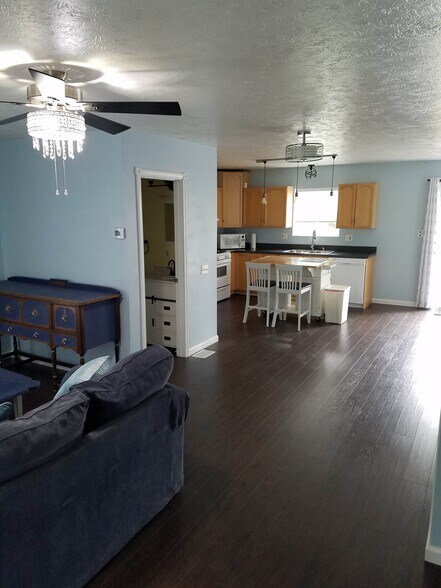 Living room leads to kitchen; half bath in between - 1801 W 47th St