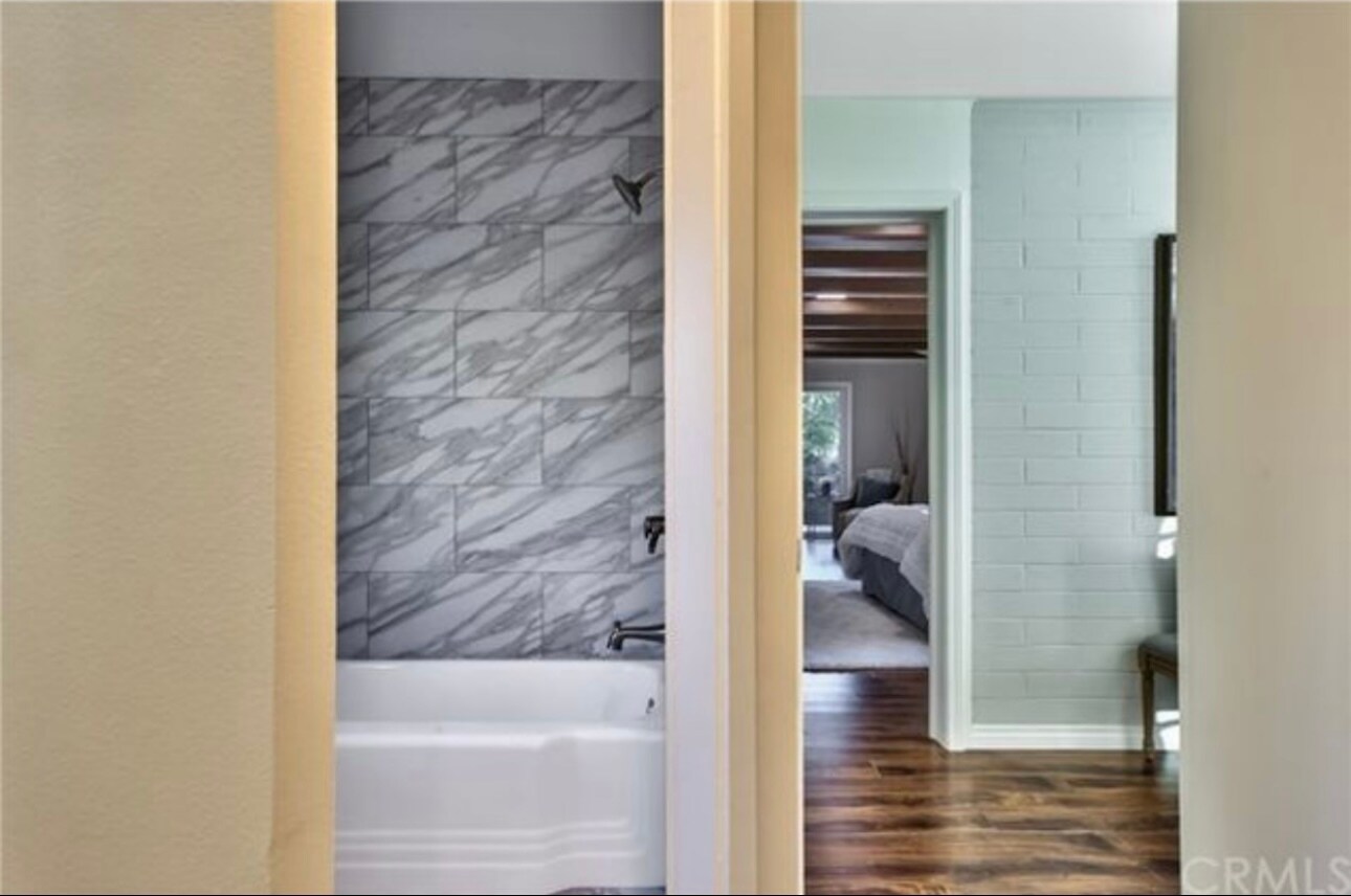 Remodeled, en suite bath with quartz counters, double sinks and modern bath/shower - 332 E Deodar St
