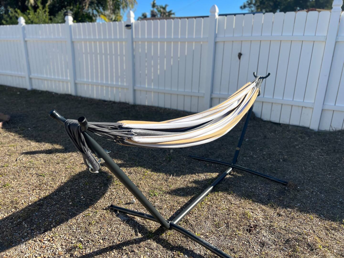 Who doesn't like a nice hammock nap? Also, two designated fire pits in back yard - 5544 Baroque Dr