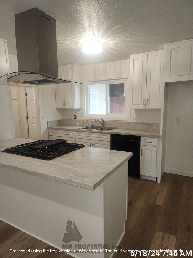 Building Photo - Welcome to this stunning 4-bedroom, 3-bath...