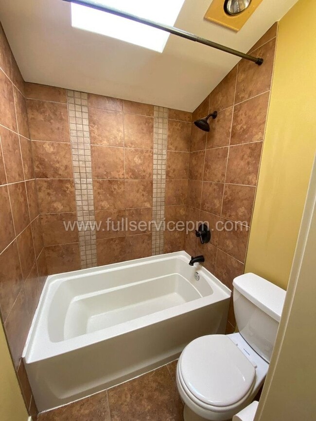 Building Photo - Spacious townhome with private backyard, garage parking, multiple decks, and a dedicated home off...
