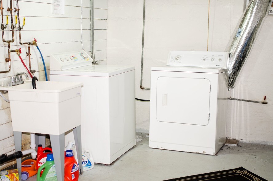 Basement Laundry and tub. - 715 5th St SE