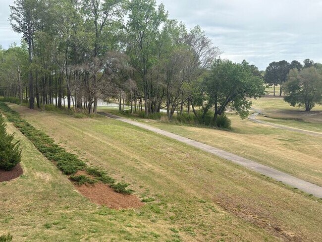 Building Photo - Scenic 3-Bed Townhome with Screened Porch, First Floor Storage & 1-Car Garage – Overlooking the G...