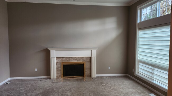 Formal living room with 11 foot ceilings and fireplace - 7409 245th Way NE