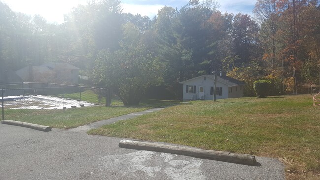 Parking area with sidewalk. - 5 Romeo Dr