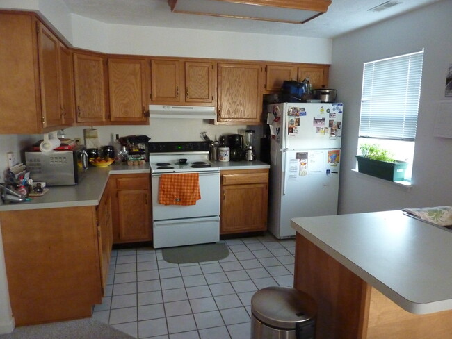 Kitchen with refrigerator/freezer, electric stove/oven, and dishwasher. (Microwave not provided) - 1413 Loop Road