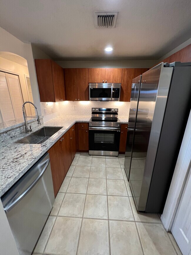New Granite countertops - 6360 NW 114th Ave