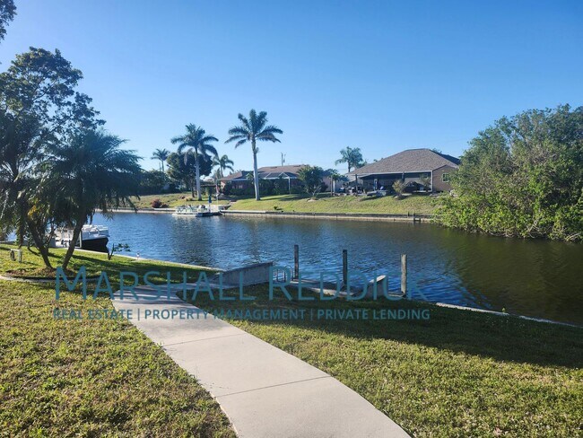 Building Photo - 3 BED 2 BATH SINGLE FAMILY HOME ON FRESH WATER CANAL WITH DOCK