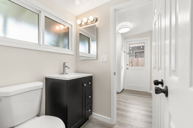 Building Photo - Charming Updated Home With Drive-Through Garage Access