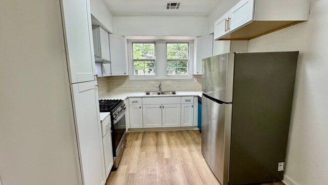 Building Photo - Spacious 3 Bedroom Home with Modern Updates & Shop