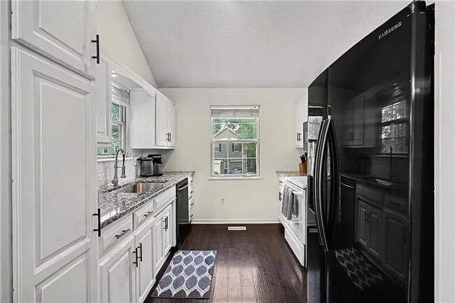 Building Photo - Newly Updated 3 Bed/2 Bath Duplex in Blue Valley with Fenced Yard, Large Deck & Attached 2-Car Ga...