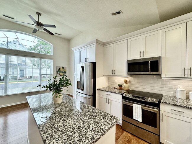 Building Photo - READY NOW!! End-Unit Loft-Style Condo w/1s...