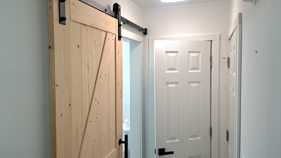 Barn door closet area. - 2467 Route 10 E