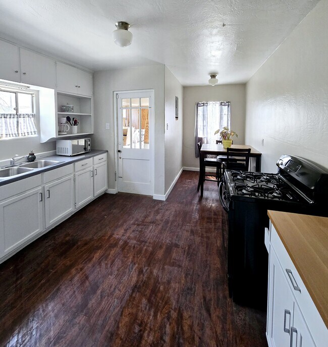 Fully stocked kitchen with full sized refrigerator - 205 Harvard Dr SE