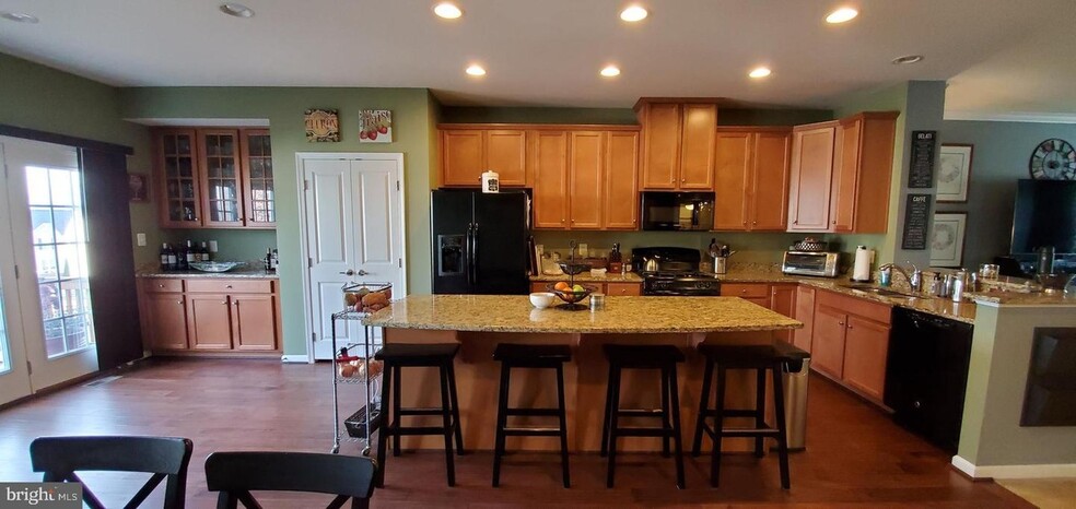 Kitchen has a long island, pantry and built-in hutch. - 3107 Alliance Ct