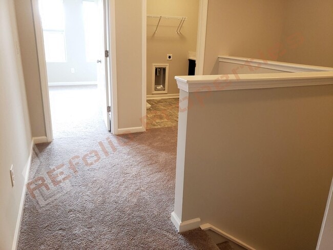 Building Photo - Beautiful Luxury 3 Story 3 Bedroom Townhome with 1st Floor Guest Suite, Attached 2 Car Garage, Co...