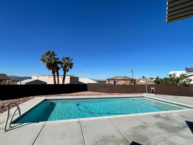 Building Photo - OWNER'S SUMMER SPECIAL-$300 OFF first 3 months! Sparkling Pool Home!