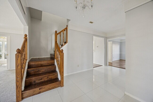 Building Photo - "Spacious 4-Bedroom, 2.5-Bath Living Meets Storybook Backyard Charm!"