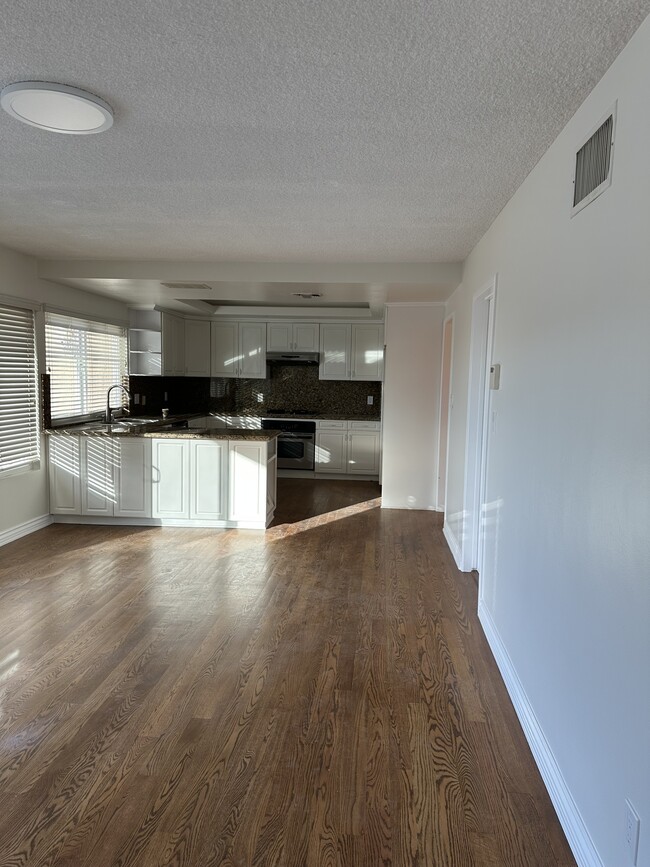 Hardwood floors in kitchen and family room. - 3816 San Augustine Dr