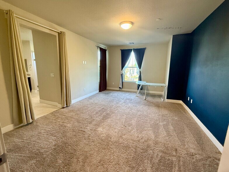 Very spacious Master bedroom with accent wall. Professionally washed all carpets. - 27 Rogers Ln