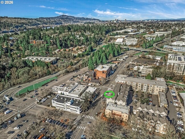 Building Photo - Main Street Living with Granite Kitchen, Gas Fireplace, and MAX Line Access