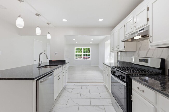 Building Photo - Experience contemporary living in this beautifully renovated residence where modern design meets ...