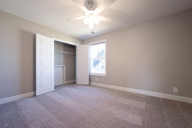 Building Photo - Elegant Home with Stone Fireplace, Kitchen Island and Designer Primary Suite