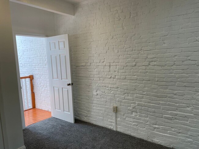 Building Photo - Charming 2-Bedroom, 1.5-Bathroom Brick Townhouse in Pigtown