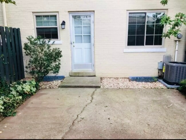 Outdoor patio and garden space with walkway to covered parking space - 1149 Cooper Dr