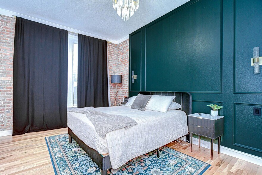 The guest bedroom features a queen bed, large closet and 32" smart tv - 215 Central Ave
