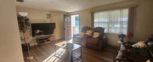 Living Room with 65 inch Smart TV with Spectrum Cable and Theater seating - 5914 Wilson Dr