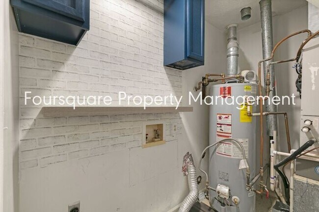 Building Photo - Charming 1st-Floor End-Unit Condo with Gas Log Fireplace, Private Back Porch & Community Pool – T...