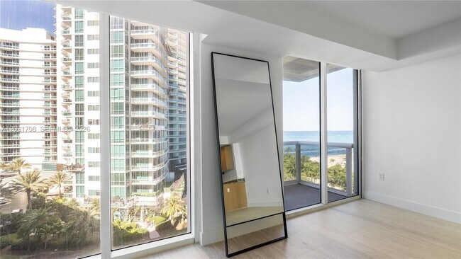 Building Photo - 10275 Collins Ave