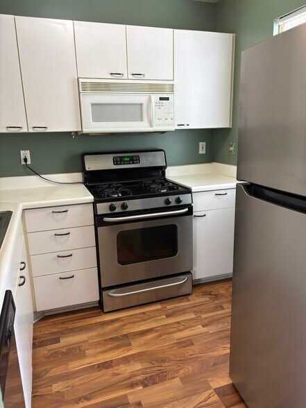 Kitchen with new refrigerator - 206 Macfalls Way