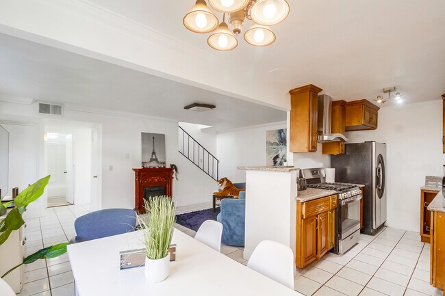 Enjoy open concept living with space to rest, cook & eat. - 2304 E 14th St