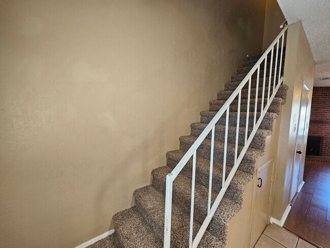 Building Photo - Stunning two-level, two-bedroom, one-and-a-half-bathroom townhome
