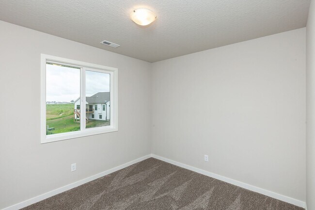 Building Photo - Prime Living: A Spacious Haven with Fenced Backyard in Ankeny