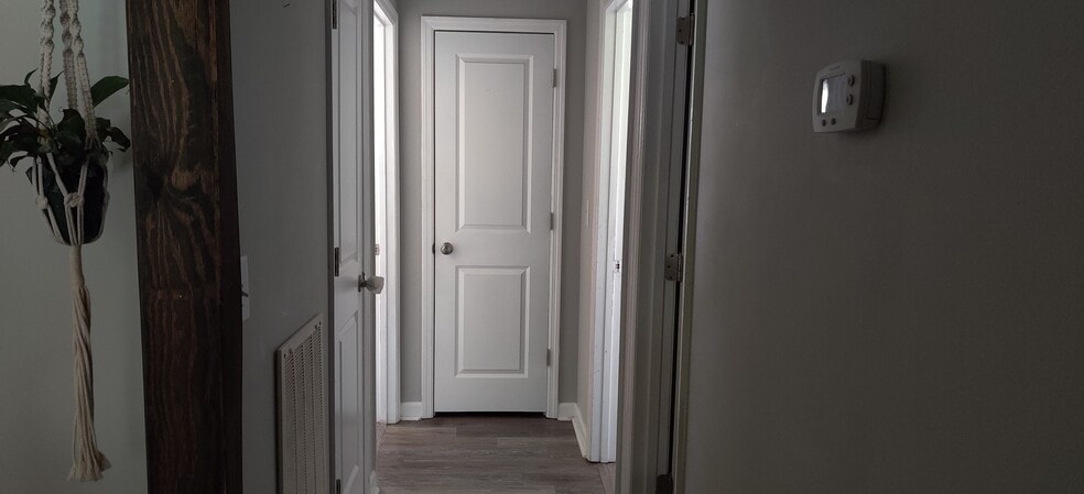 hallway/two hallway closets with guest bathroom on the right - 102 Anna Ct
