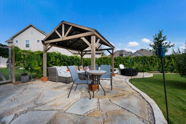Building Photo - 4 Bedroom Home with Stone Patio, Built-In Gazebo & Amenity-Rich Community Living